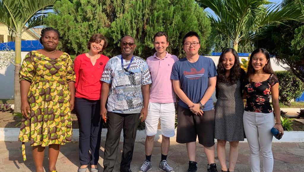 Askar Salikhov, Jingxuan Wang, and Esther Chung pose for a photograph with project managers Akpene Amenumey and Victoria Klimova, project assistant Daniel Tagoe, and IOM intern Bowie Ko on the last day of the internship